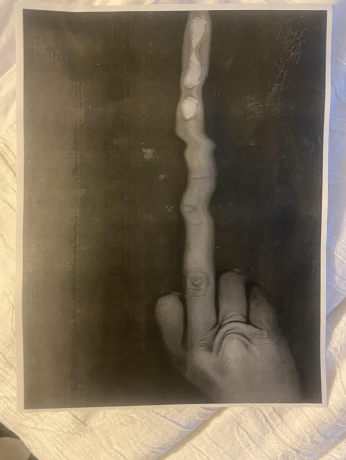 a hand with a long finger