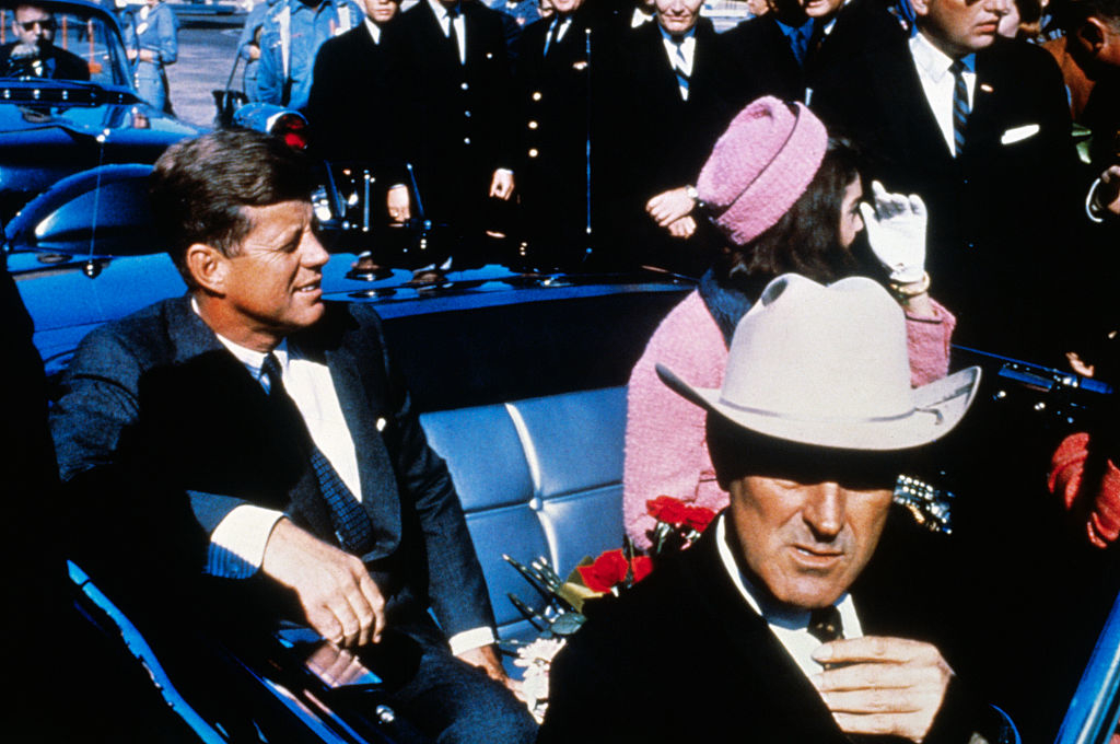 JFK and Jackie Kennedy in the back of the car