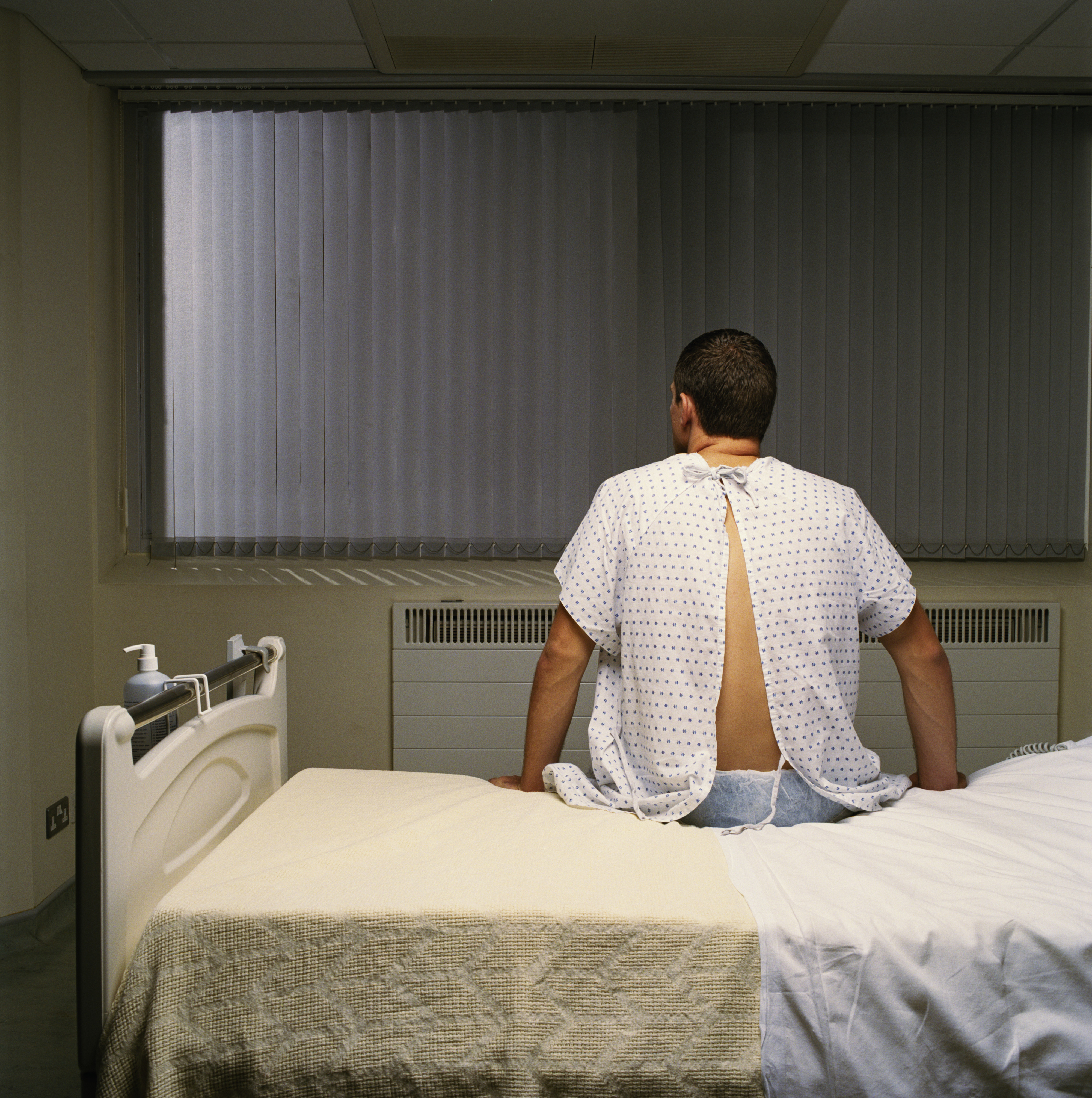 man sitting on a hospital bed