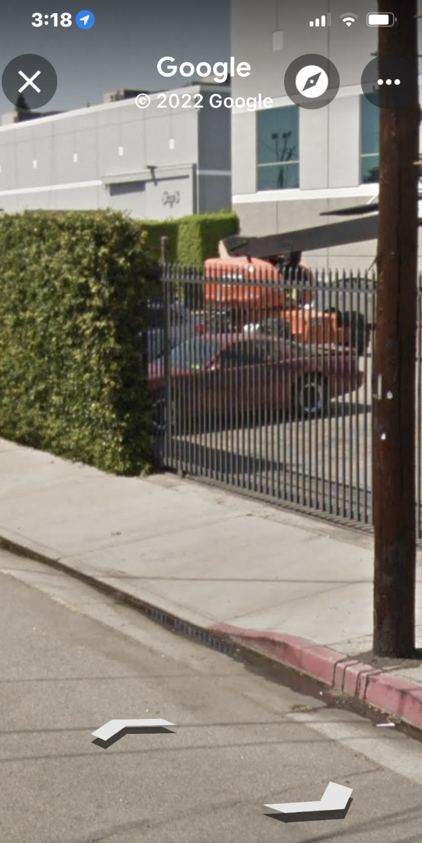 a car behind a gate