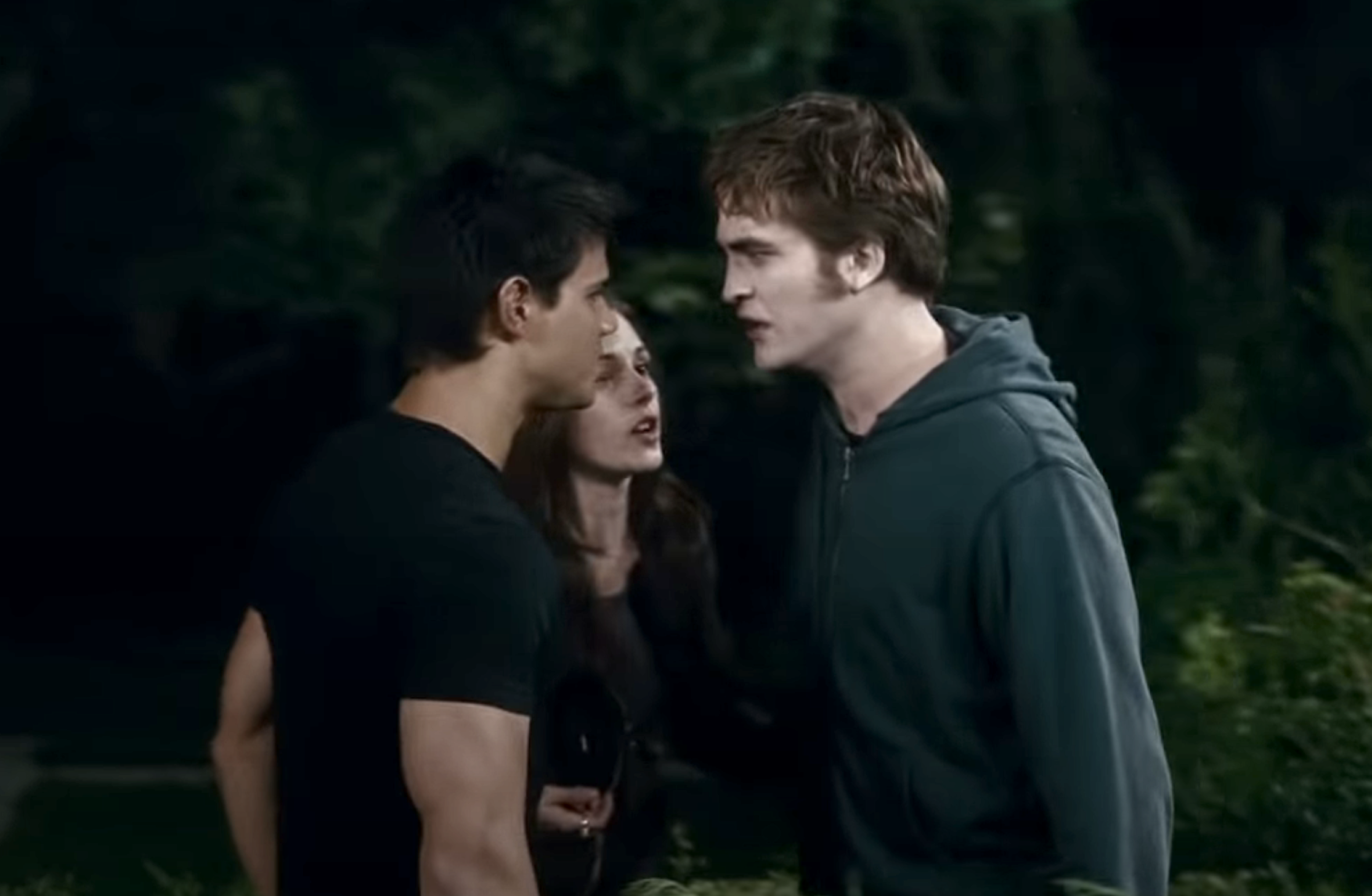 Edward and Jacob in a fight with Bella in the center