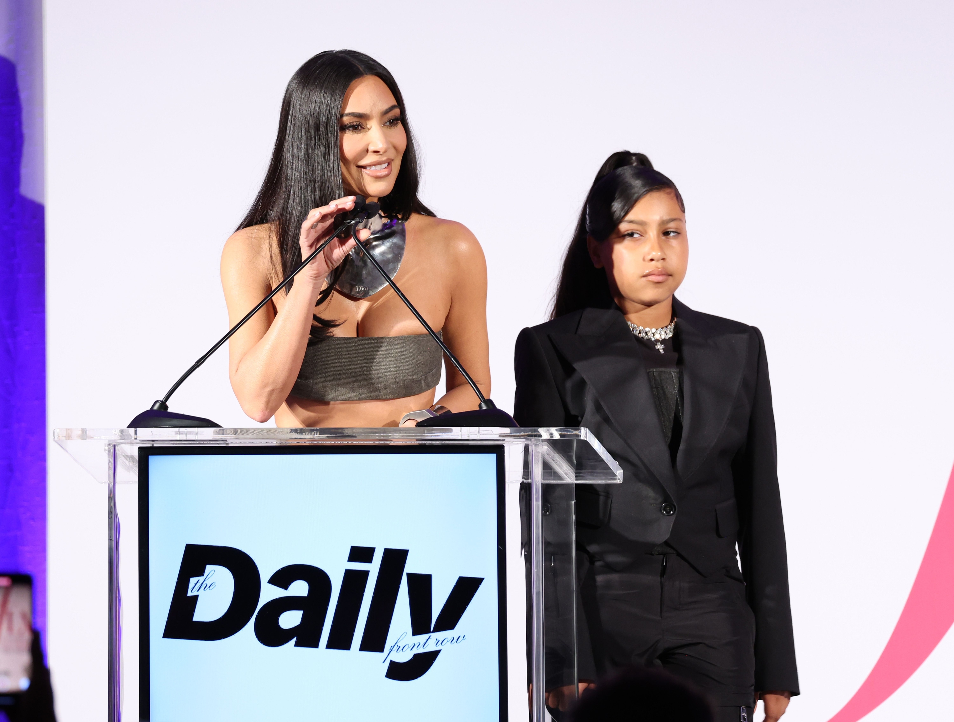 Kim and North at a podium