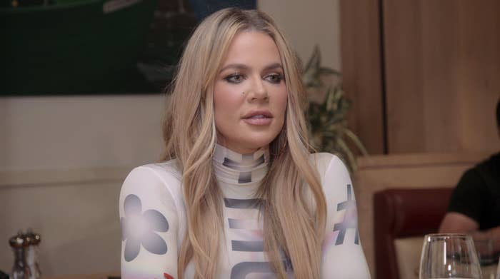 A closeup of Khloé sitting