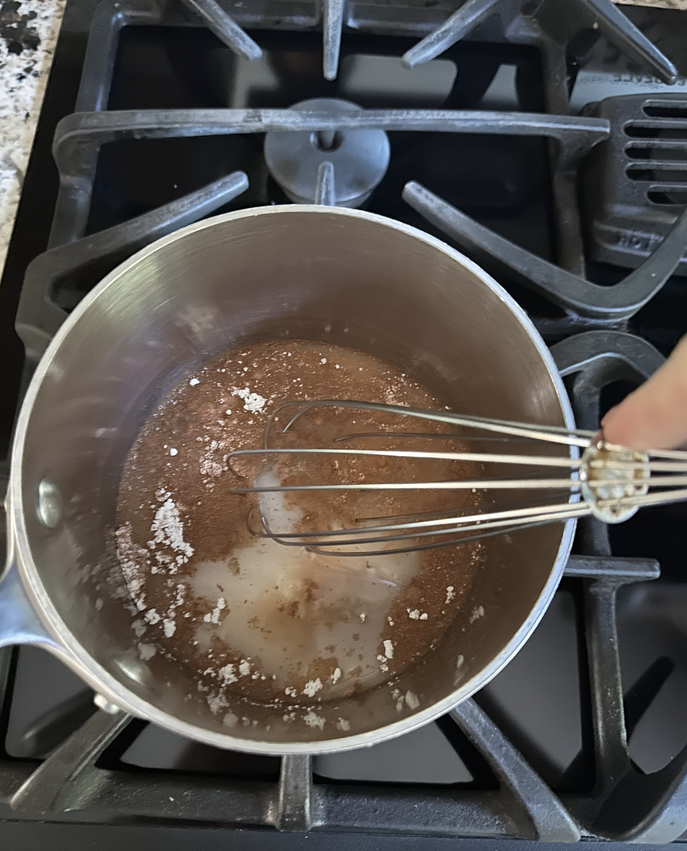 a mixture in a small pot on a stovetop