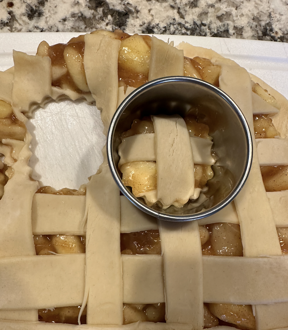 cookies being cut with a cookie cutter