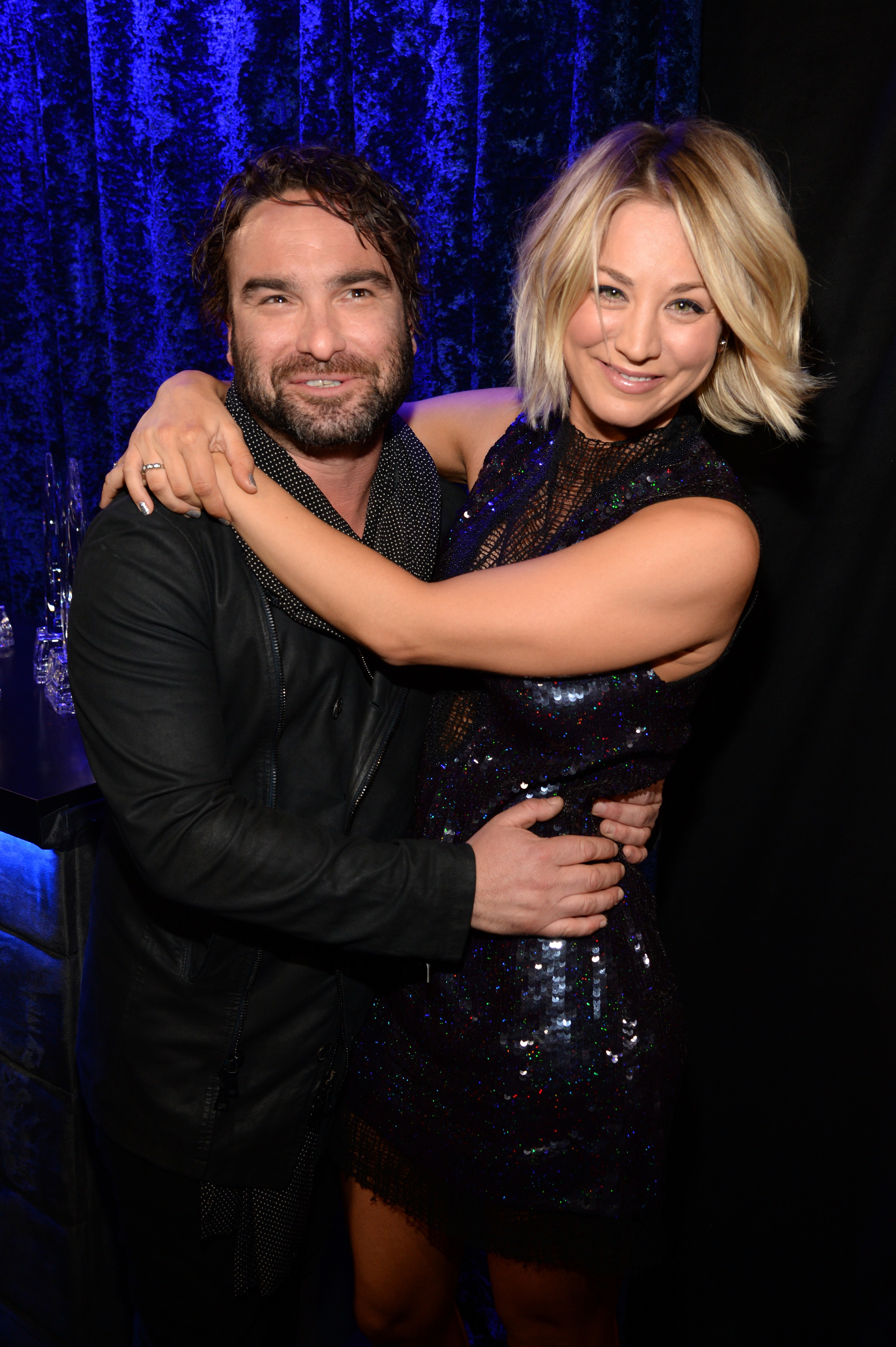 Kaley and Johnny smiling and embracing
