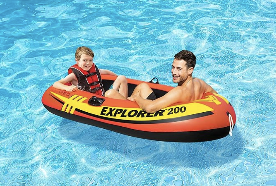 A father and son on an inflatable boat