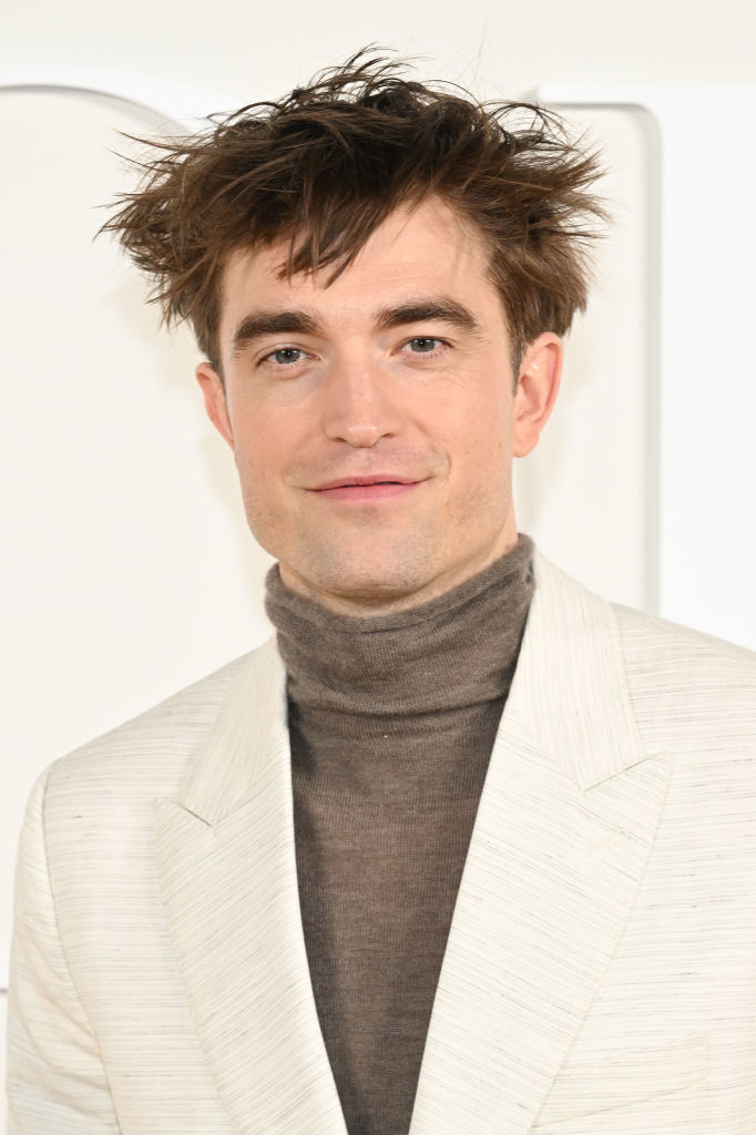 Closeup of Robert Pattinson in a turtleneck and blazer