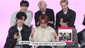 GIF of Stray Kids taking the quiz