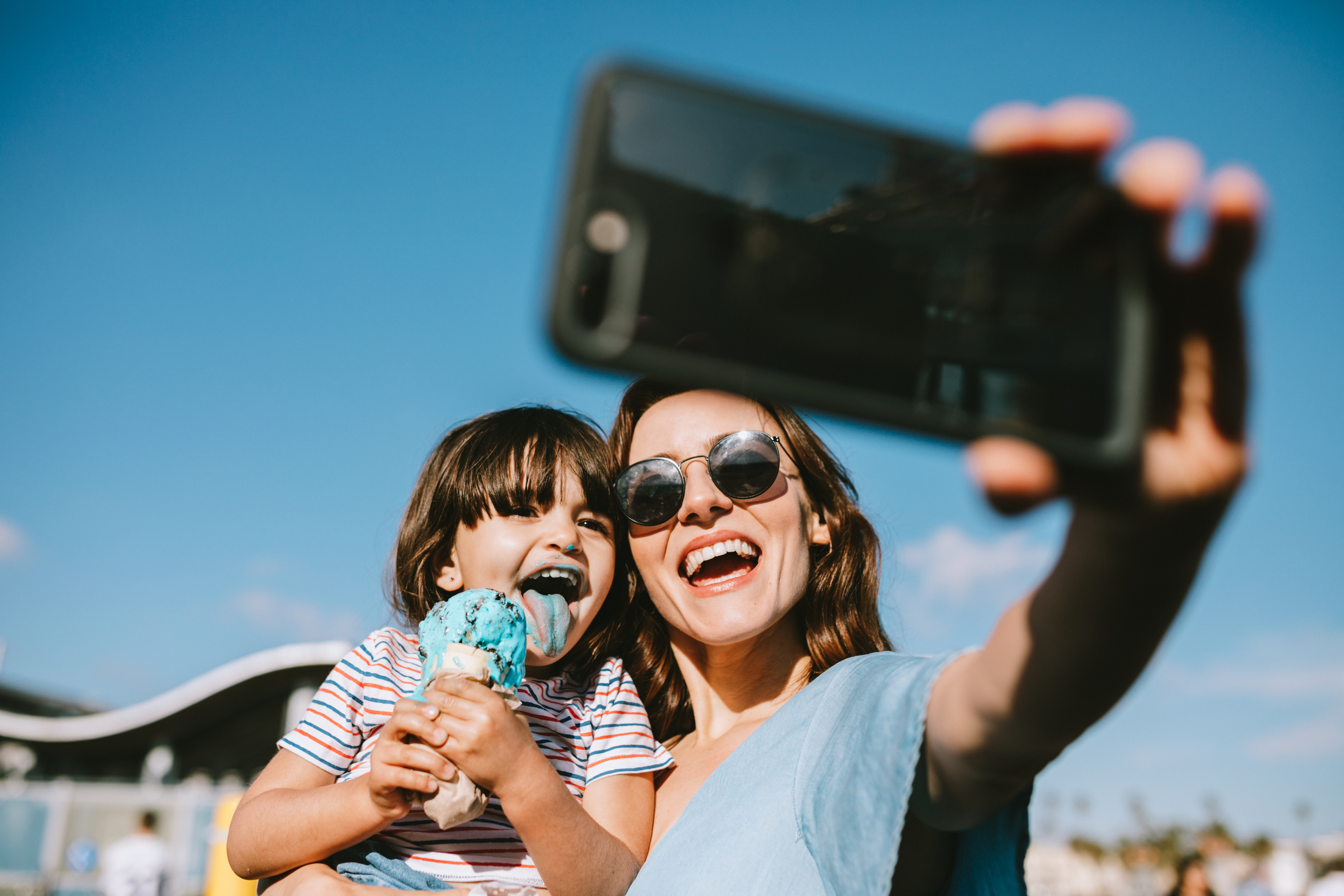 A woman taking a selfie of her and her child