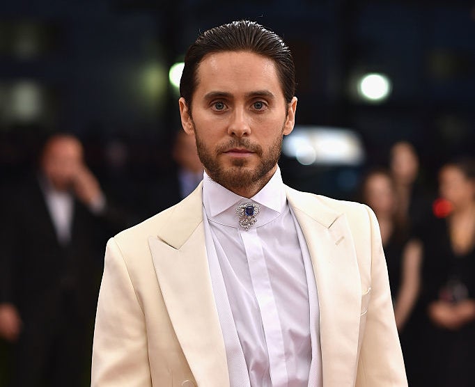 Close-up of Jared in 2016 in a white jacket and brooch