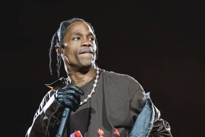 Close-up of Travis holding a microphone