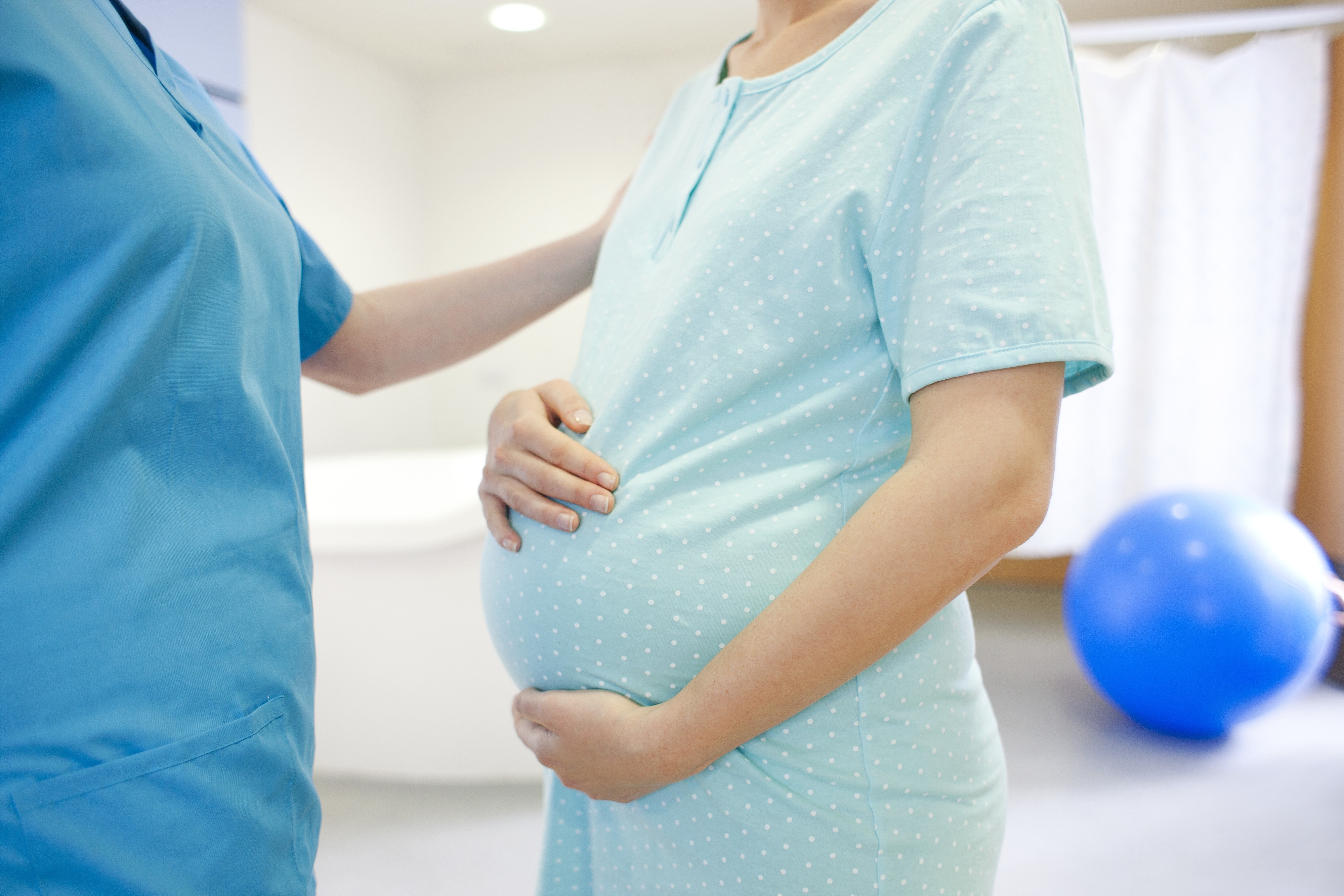 Nurse talking with a pregnant woman