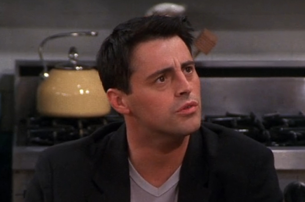 Joey from Friends scrunches his brows, mouth slightly open as if confused