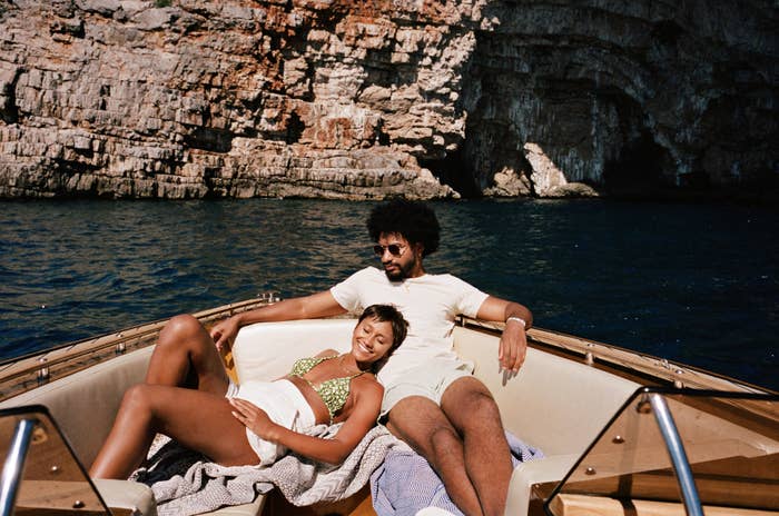 A couple is relaxing on a boat