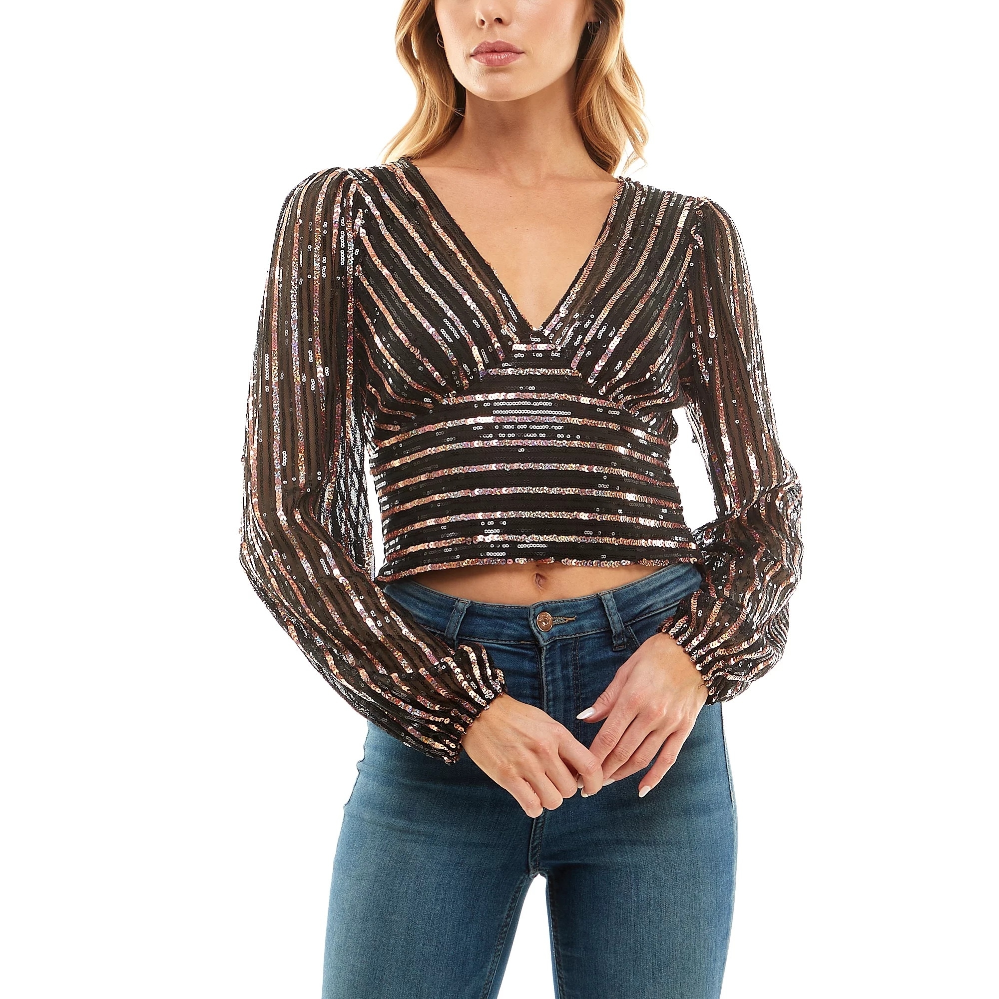 A model wearing the long sleeve V-neck top in a striped sequined design