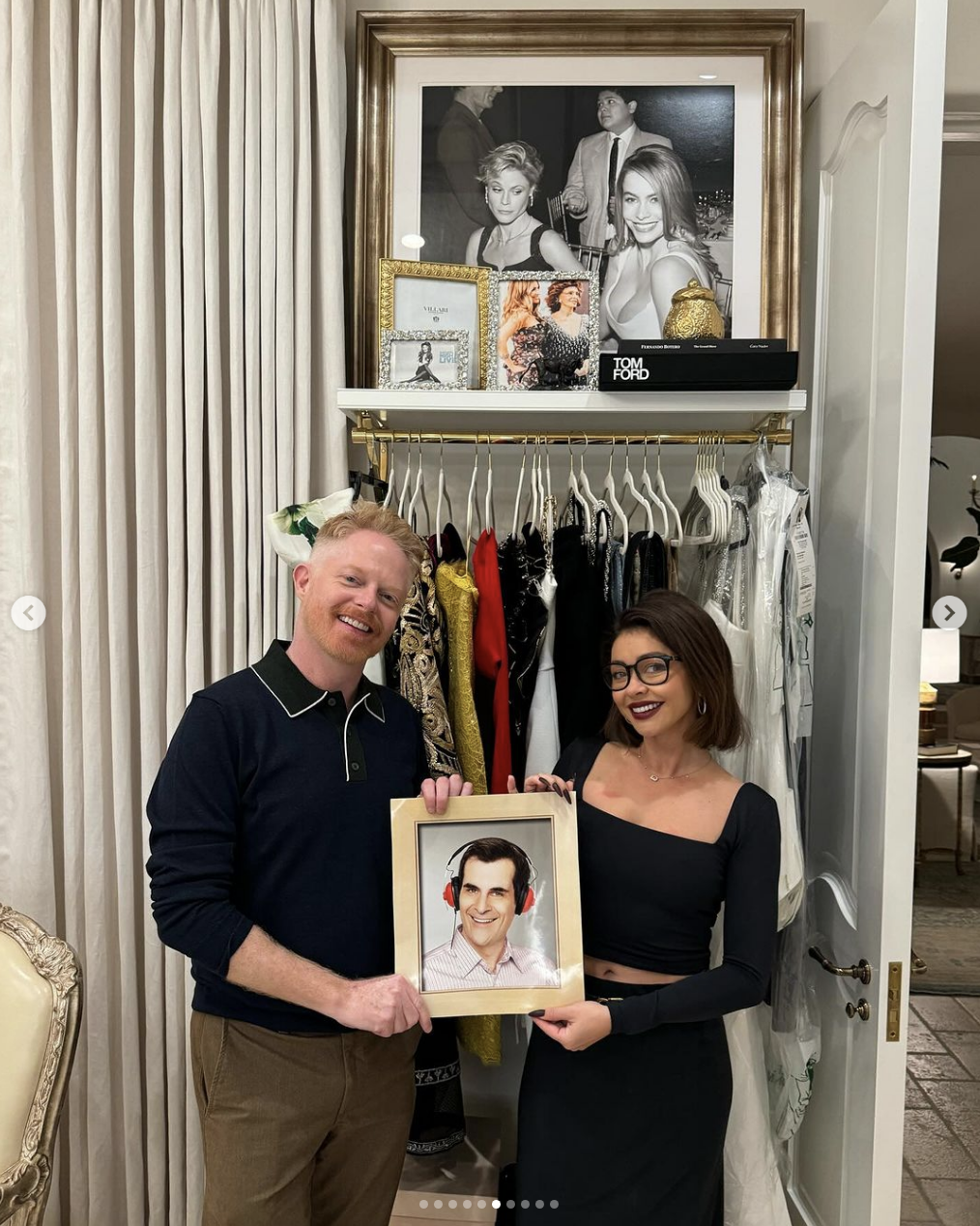 Jesse and Sarah holding a photo of Ty Burrell