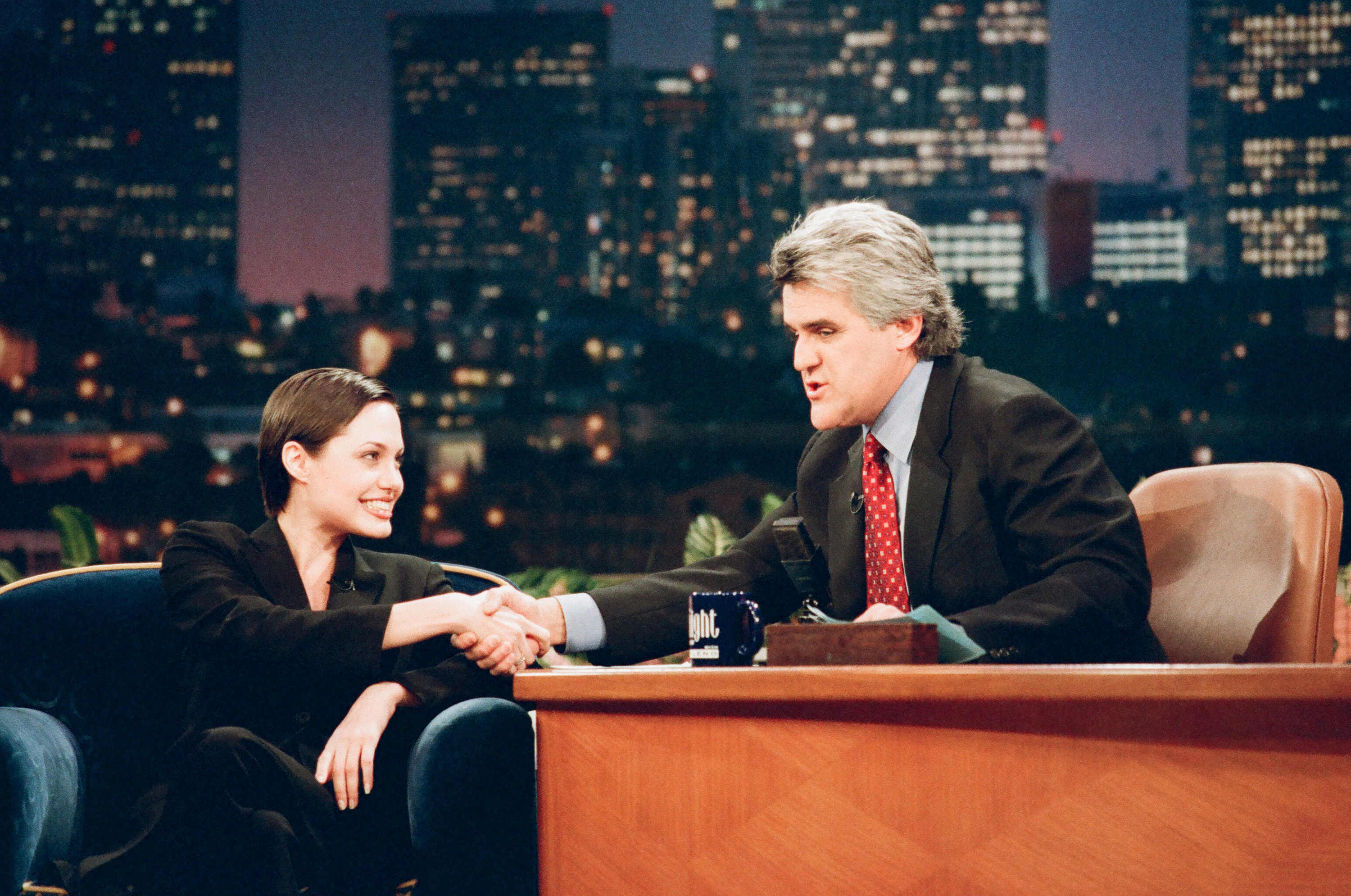 Close-up of Angie shaking Jay&#x27;s hand on his show