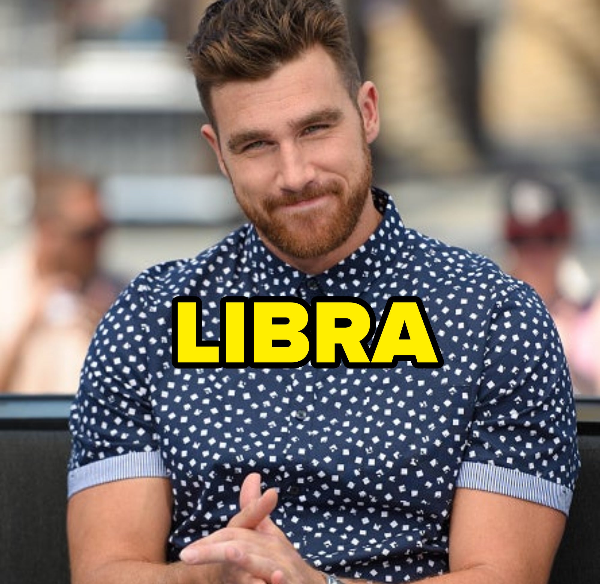 libra written over a photo of him in a polka dot shirt grinning