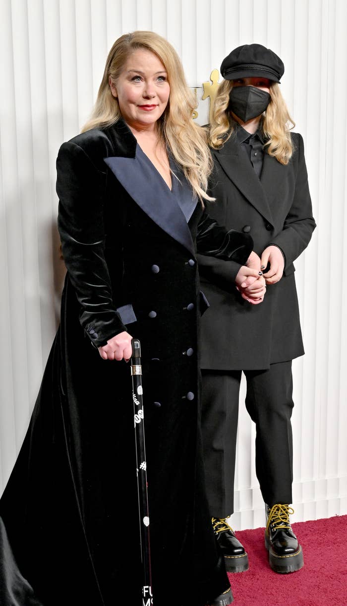 closeup of her on the red carpet in a long velvet dress with her cane