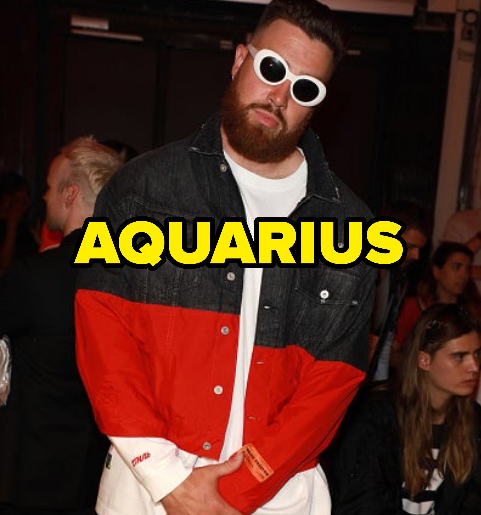 aquarius written over a photo of him in sunglasses at night wearing a colorful jacket