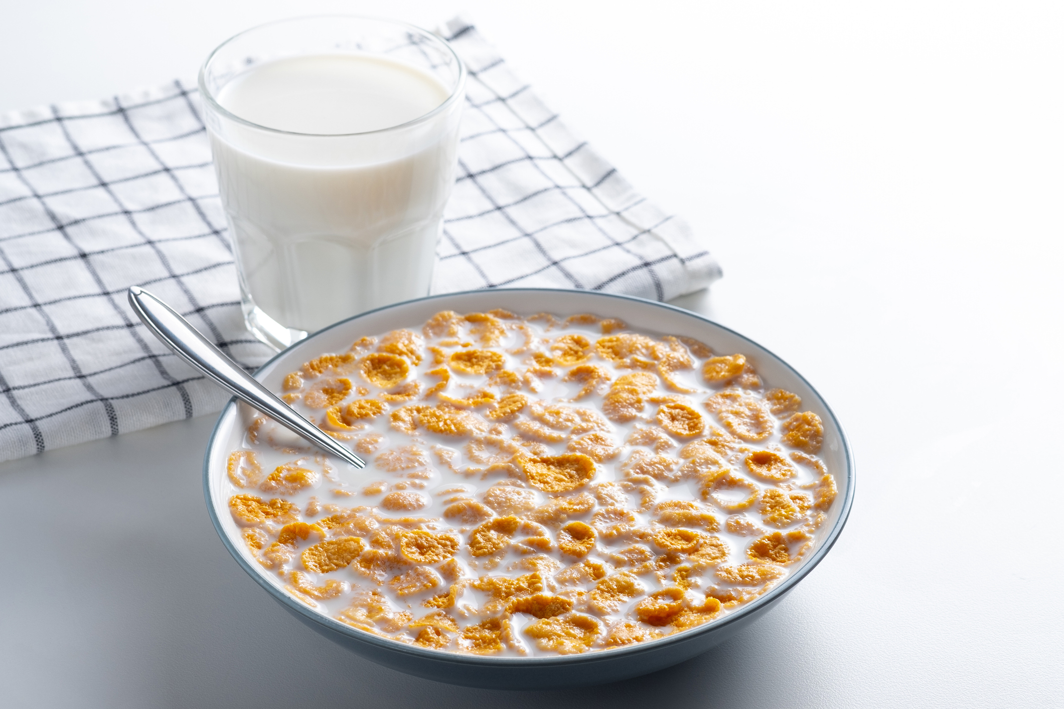 a bowl of cereal and a glass of milk