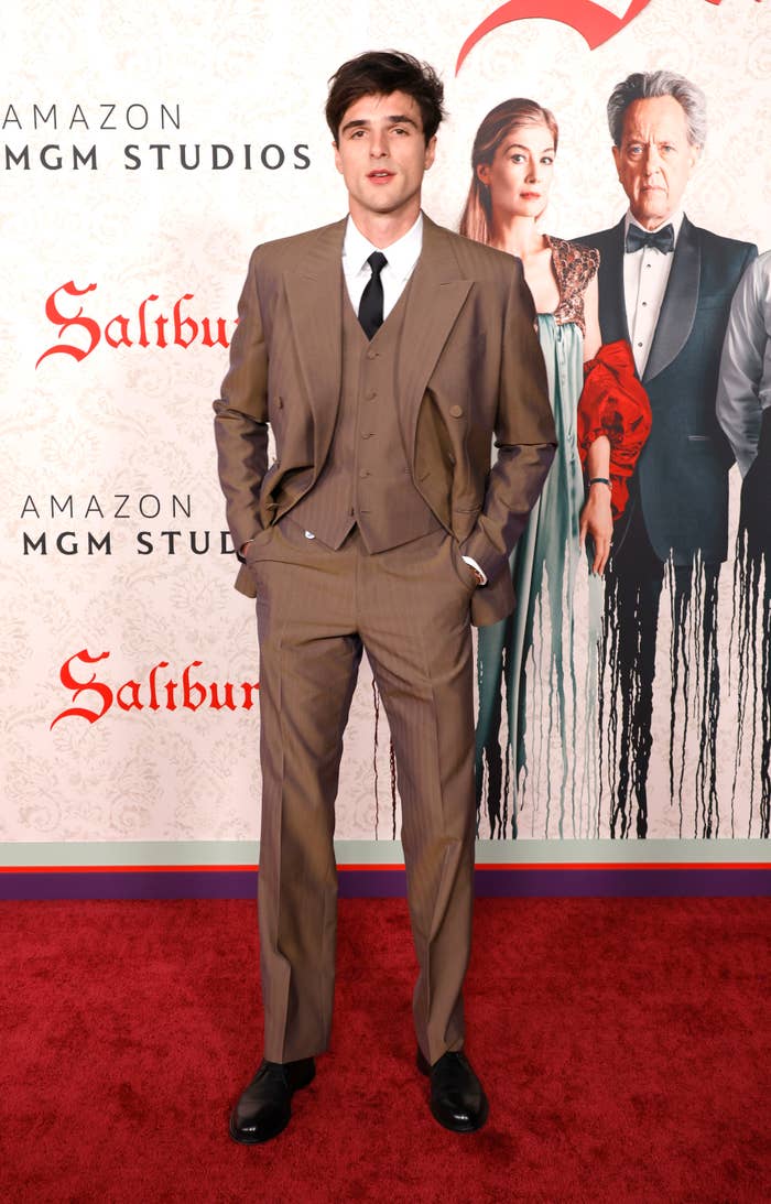 Close-up of Jacob on the red carpet in a suit, vest, and tie