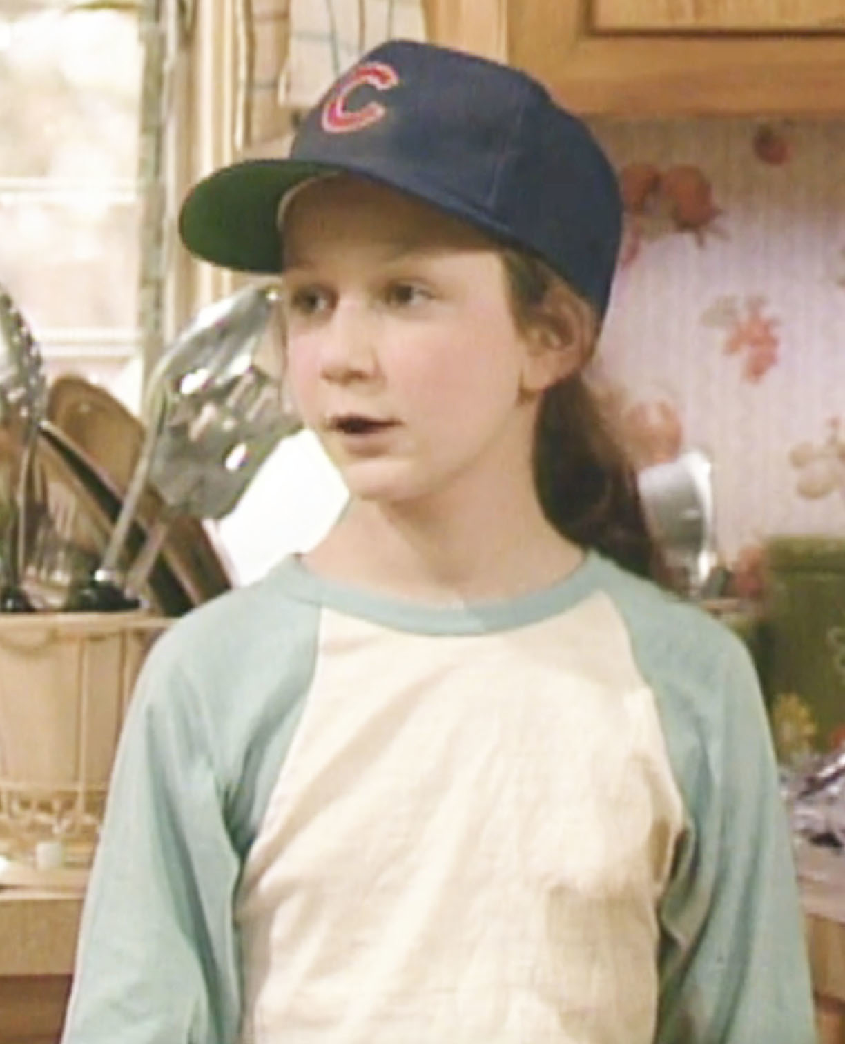 young character wearing a baseball hat