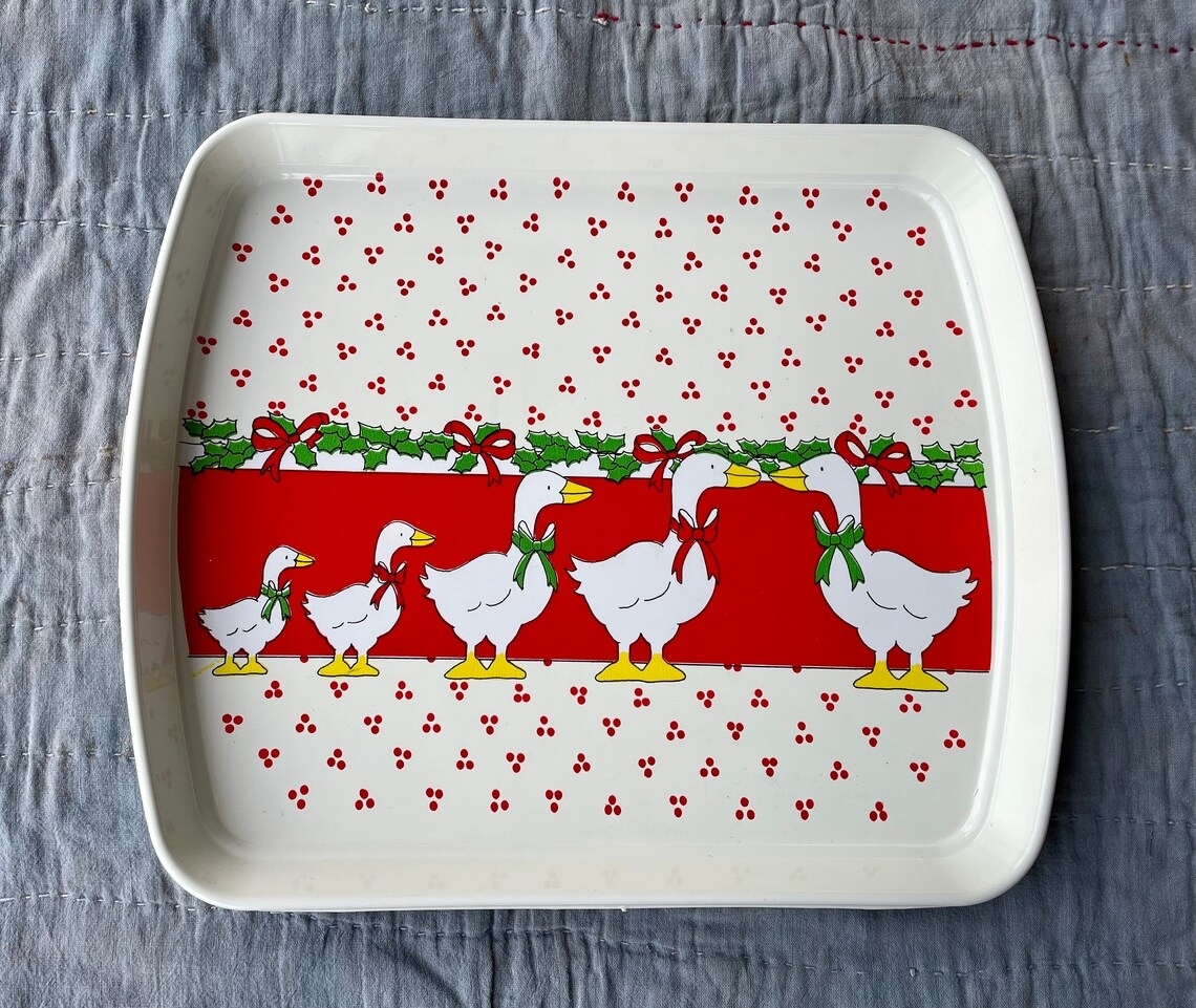 A platter decorated with geese wearing Xmas neck bows
