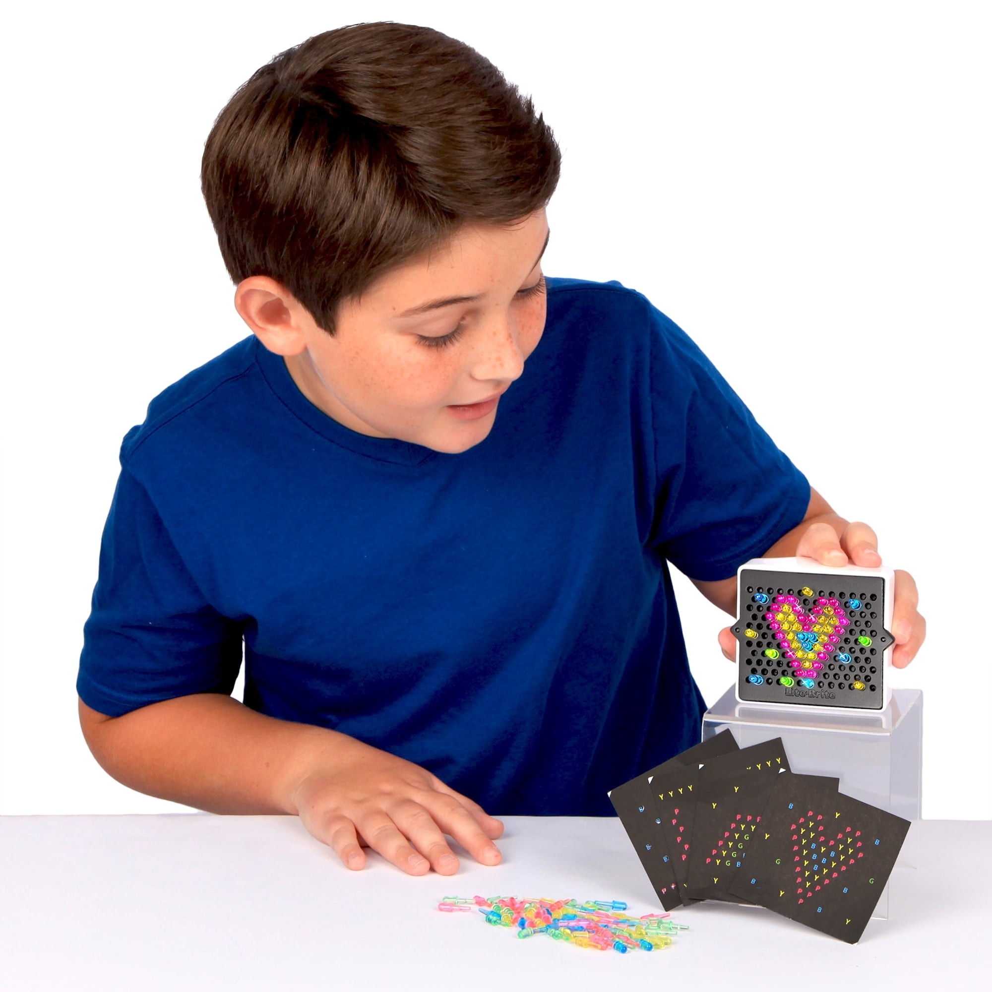 child playing with colorful light boards
