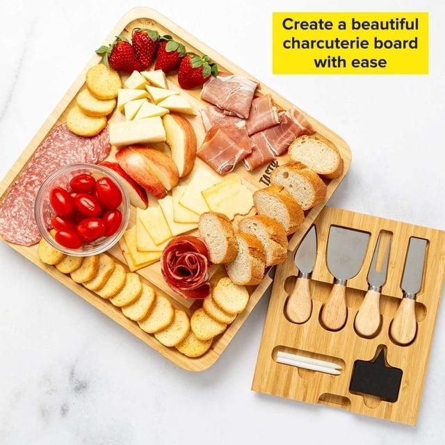 the charcuterie board with meats and cheeses on it and the utensils next to it