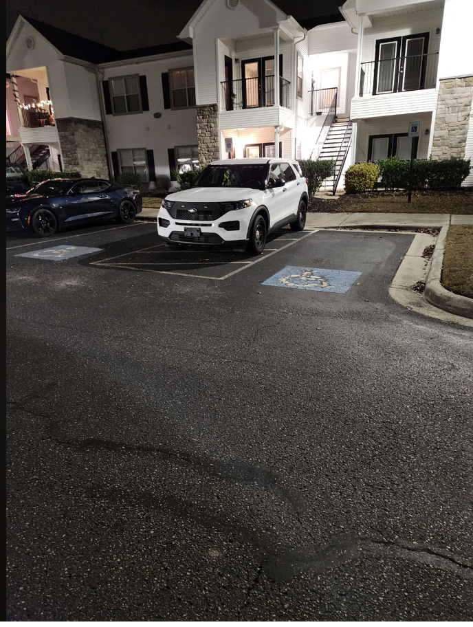 An SUV not parked in an adequate spot
