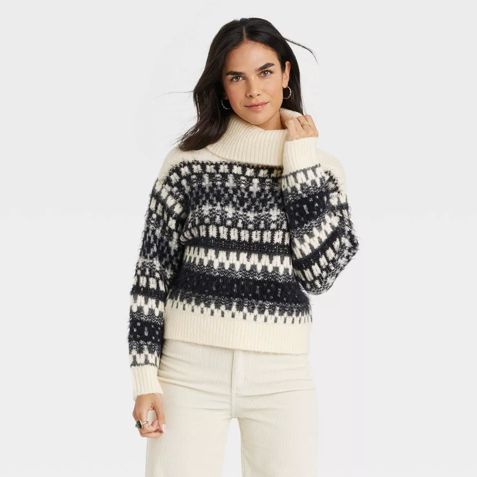 model wearing fuzzy knit turtle neck sweater with winter design