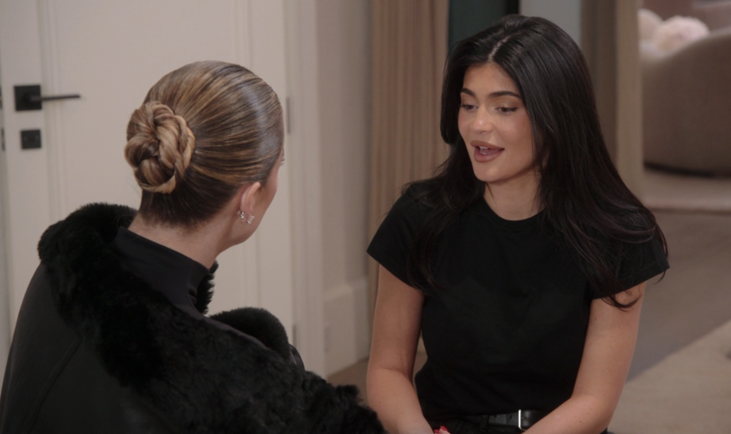 Close-up of Khloé and Kylie talking