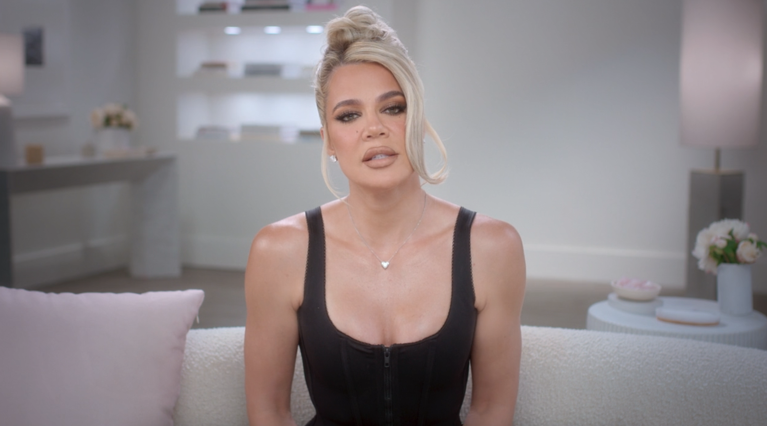 Close-up of Khloé on a couch