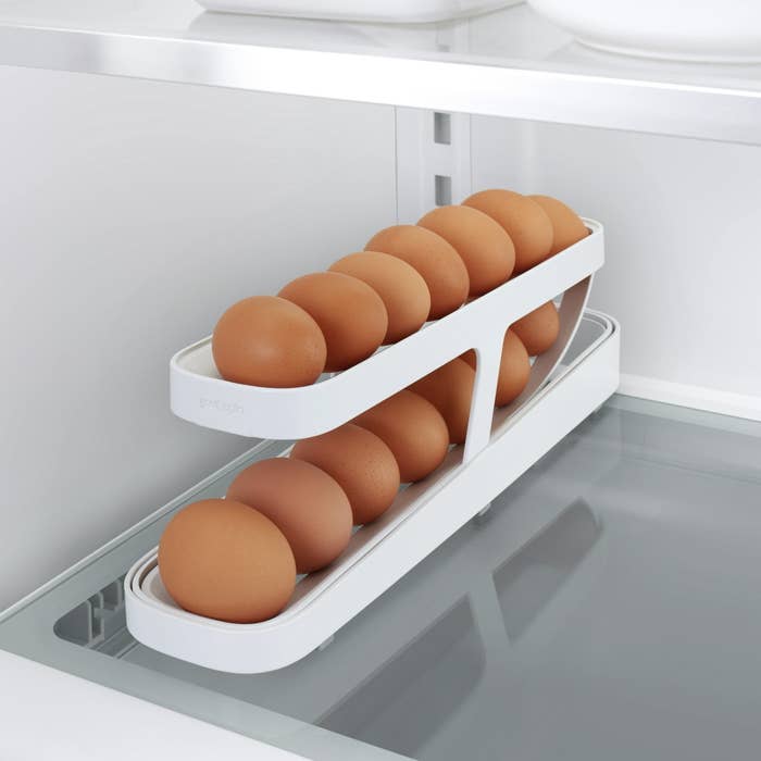an inclined egg dispenser in a fridge