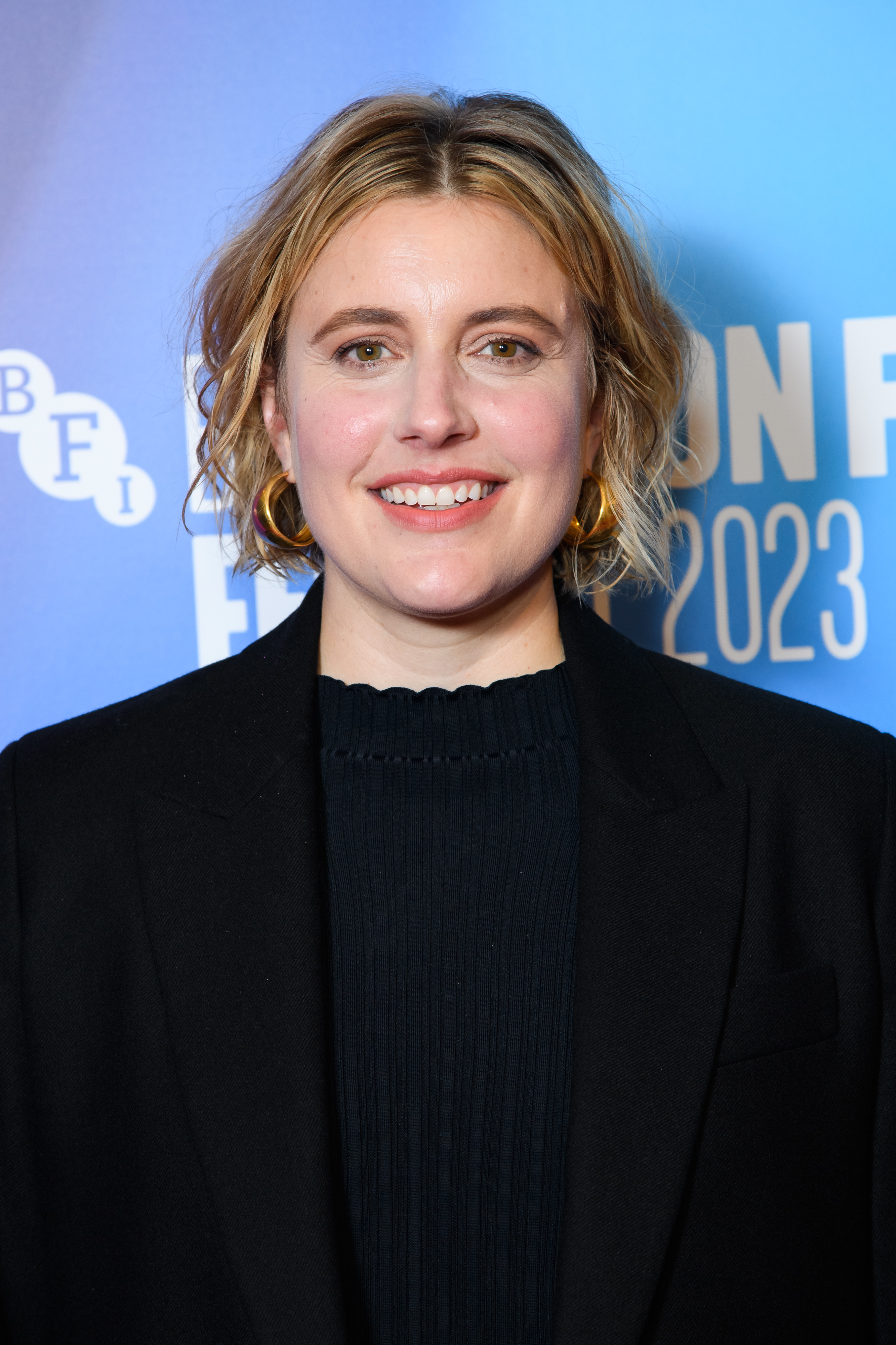 Close-up of Greta smiling at a media event