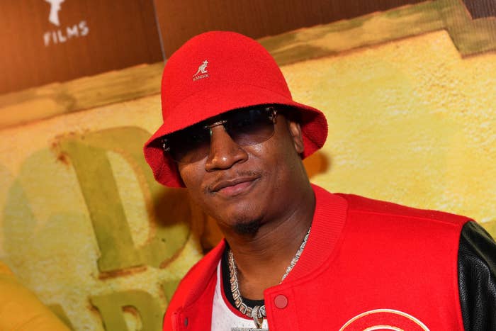Close-up of Yung Joc in sunglasses and a Kangol bucket hat