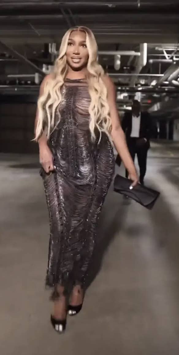 her walking in the slinky see through dress