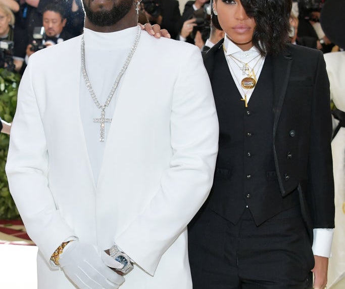 Close-up of Cassie and Diddy with paparazzi behind them