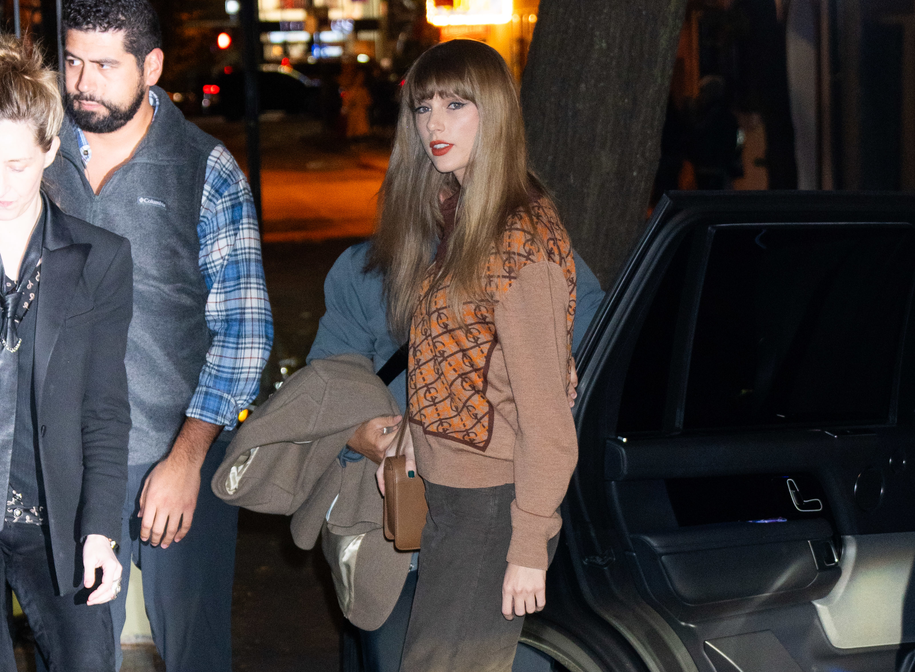 Close-up of Taylor near a car