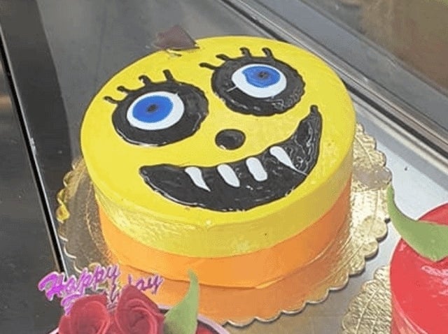 creepy face drawn onto a cake