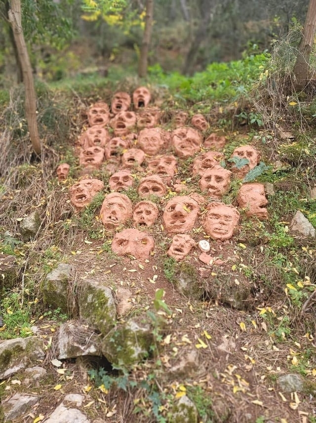 rocks on a hiking trail looks like faces