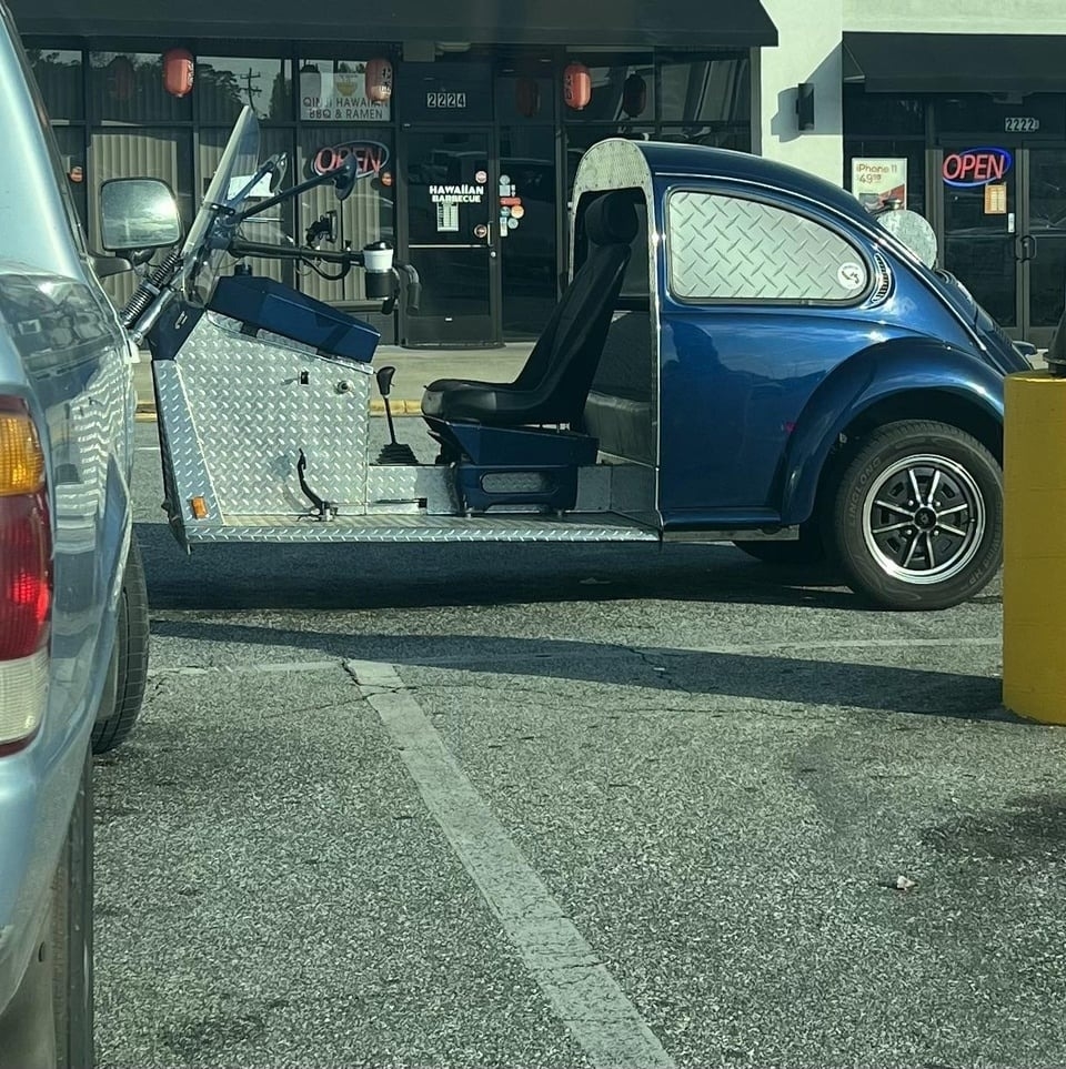 volkswagon buggy with an no doors or exterior around the front half