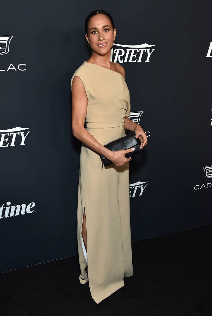 Megan on the red carpet at the variety event in a one-shouldered dress