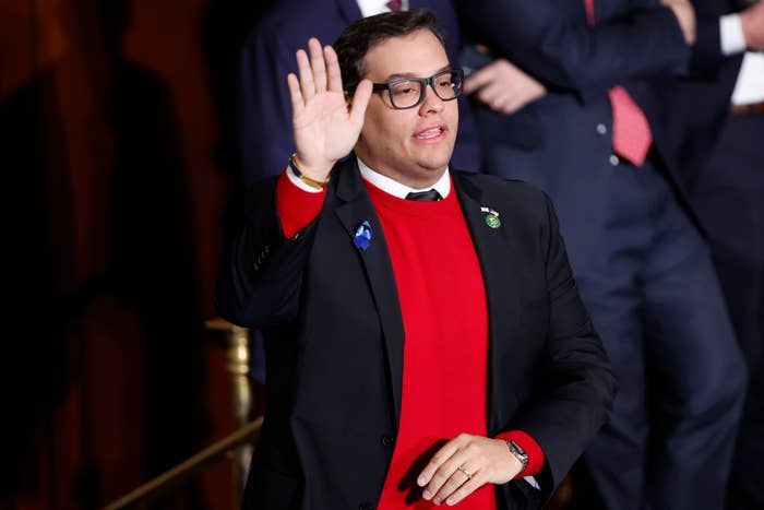 george santos putting his hand up to take an oath