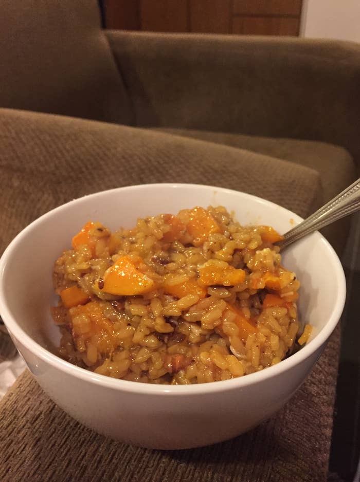 Gross looking photo of risotto in a bowl on the side of a couch