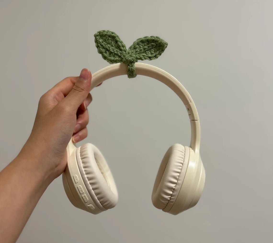 green sprout leaf on headphones