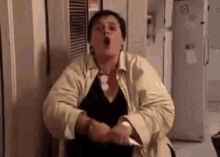 A woman yelling and gesturing in anger