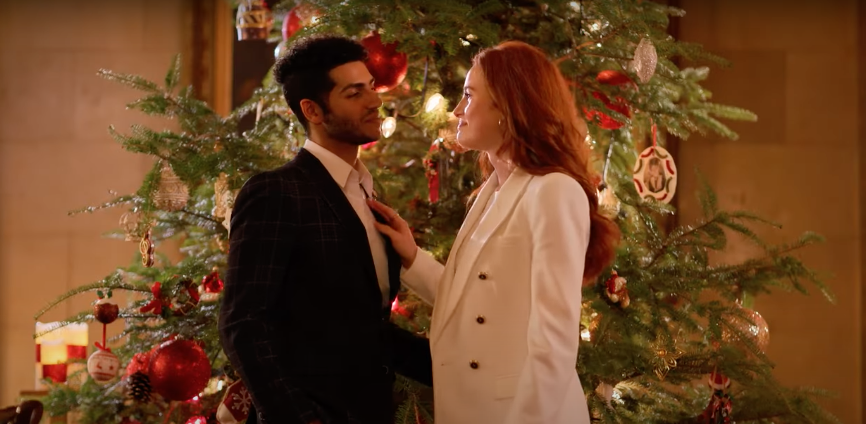 Madelaine Petsch and Mena Massoud in hotel for the holidays